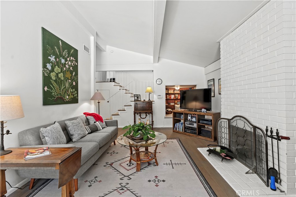 4214 Tosca Road Woodland Hills, CA 91364 - Photo 6 of 24 a living room with furniture and a flat screen tv