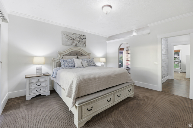 2342 Charros Road Sandy, UT 84092 - Photo 32 of 94 Spacious room featuring neutral carpeting, white walls, and elegant crown molding