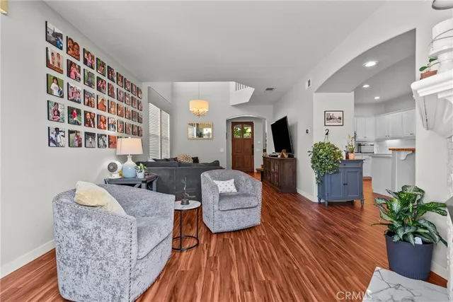 a living room with furniture and a bookshelf