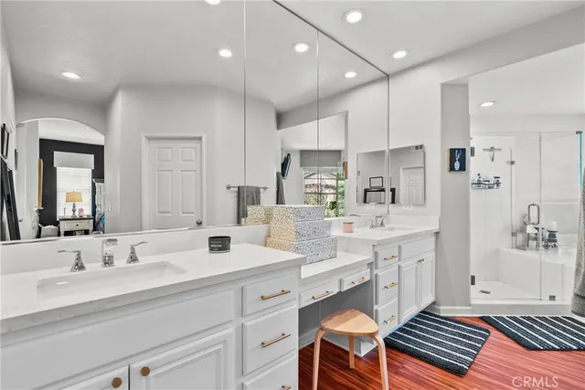 a bathroom with a double vanity sink mirror and double