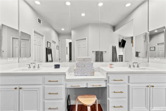 a bathroom with a double vanity sink mirror and double