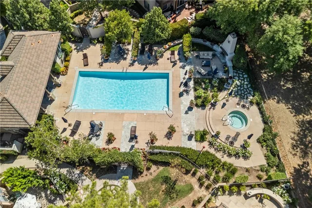 an aerial view of a house with outdoor space
