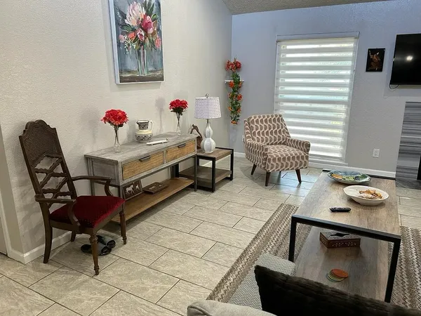 a dining room with furniture and window