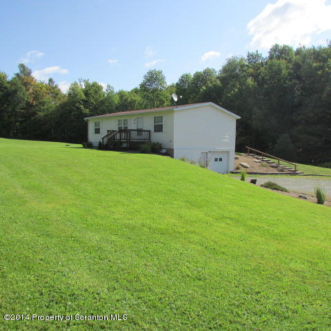 2000 Booth Road Hallstead, PA 18822 - Photo 1 of 15 a backyard of a house with lots of green space