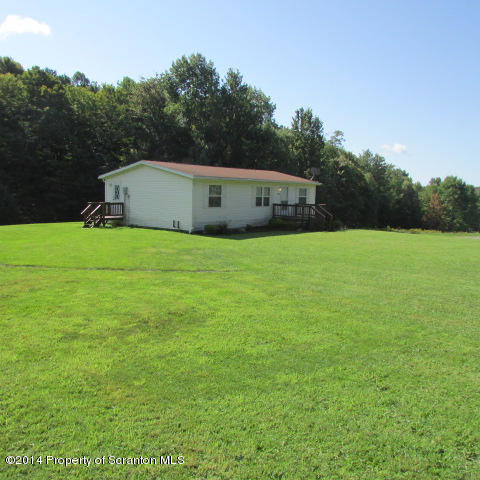 2000 Booth Road Hallstead, PA 18822 - Photo 14 of 15 a house with a field