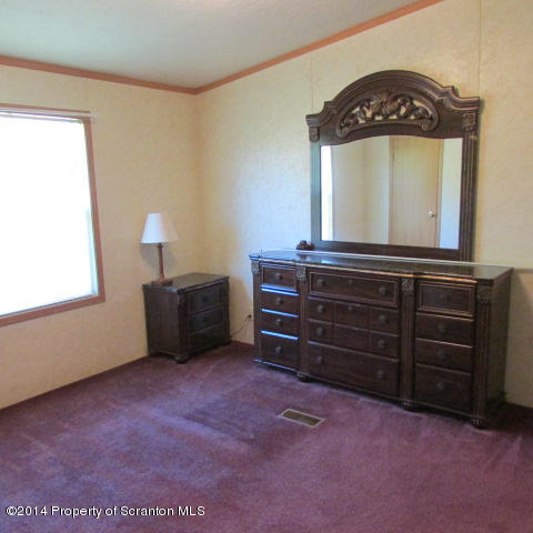 2000 Booth Road Hallstead, PA 18822 - Photo 5 of 15 a view of a room with furniture and mirror