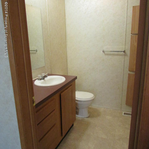 2000 Booth Road Hallstead, PA 18822 - Photo 6 of 15 a bathroom with a sink a toilet and a mirror