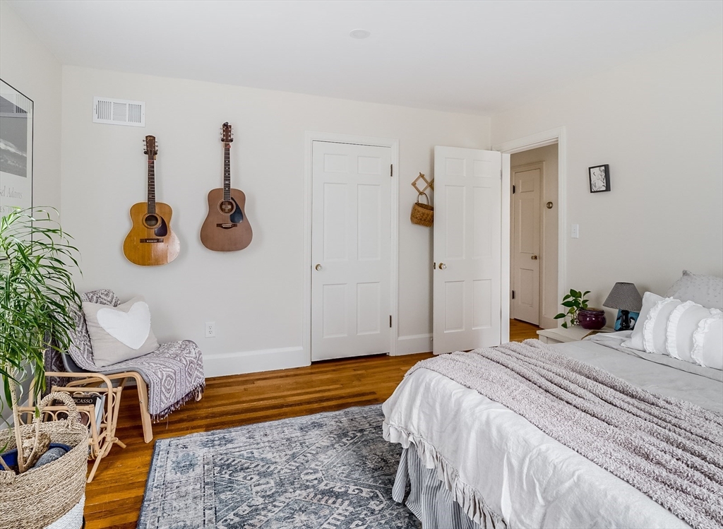 183 Sterling Road Princeton, MA 01541 - Photo 13 of 35 a bedroom with a bed and a potted plant