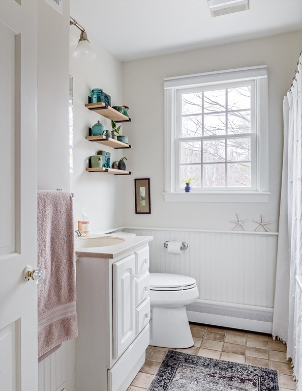 183 Sterling Road Princeton, MA 01541 - Photo 16 of 35 a bathroom with a sink toilet and window