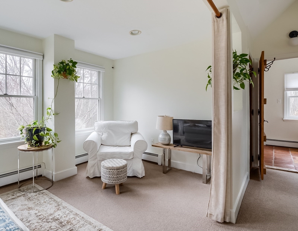183 Sterling Road Princeton, MA 01541 - Photo 21 of 35 a living room with furniture and a potted plant