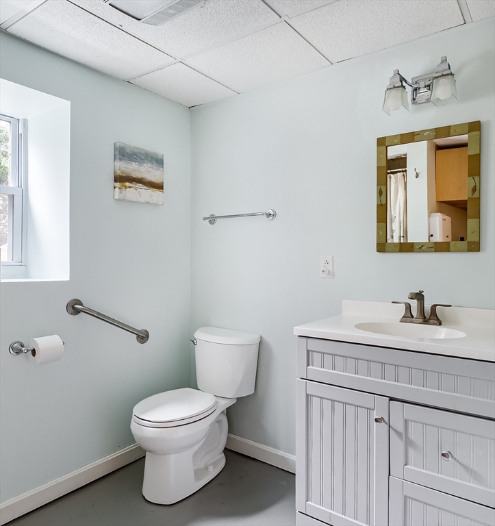 183 Sterling Road Princeton, MA 01541 - Photo 26 of 35 a bathroom with a toilet sink vanity and mirror