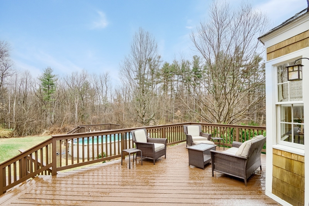 183 Sterling Road Princeton, MA 01541 - Photo 30 of 35 a view of a balcony with couch and wooden floor