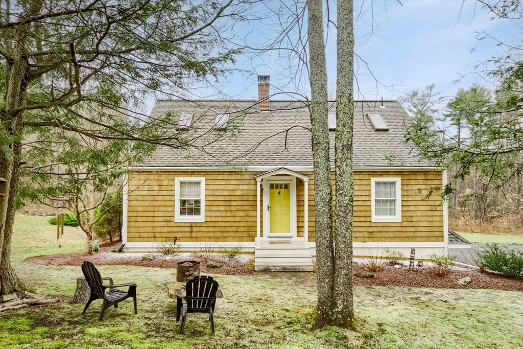 183 Sterling Road Princeton, MA 01541 - Photo 34 of 35 a backyard of a house with barbeque oven table and chairs