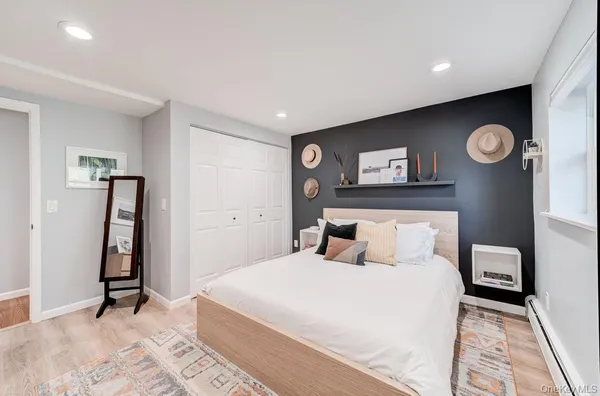 a bedroom with a bed and a table in it