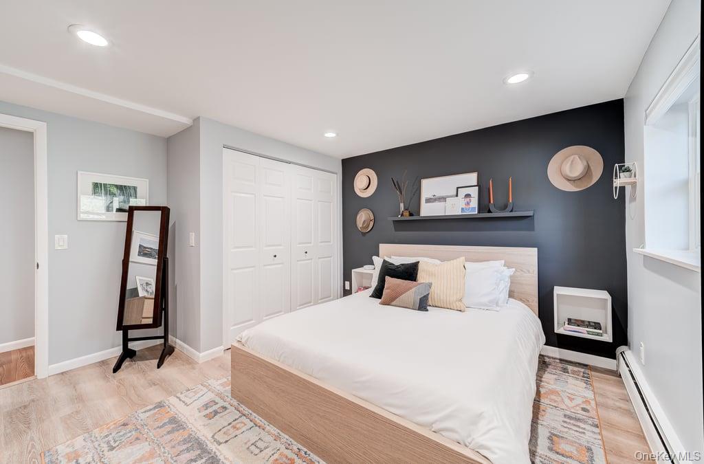 4 Forge Gate Drive, Unit F3 Cold Spring, NY 10516 - Photo 15 of 20 a bedroom with a bed and a table in it