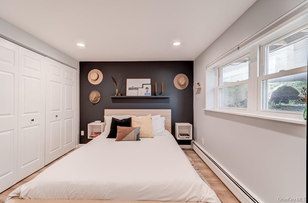 4 Forge Gate Drive, Unit F3 Cold Spring, NY 10516 - Photo 16 of 20 a bedroom with a bed and a large window