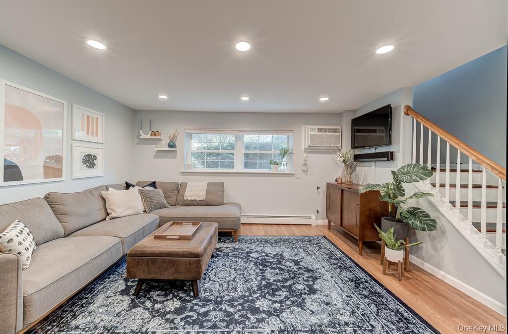 4 Forge Gate Drive, Unit F3 Cold Spring, NY 10516 - Photo 3 of 20 a living room with furniture and a flat screen tv