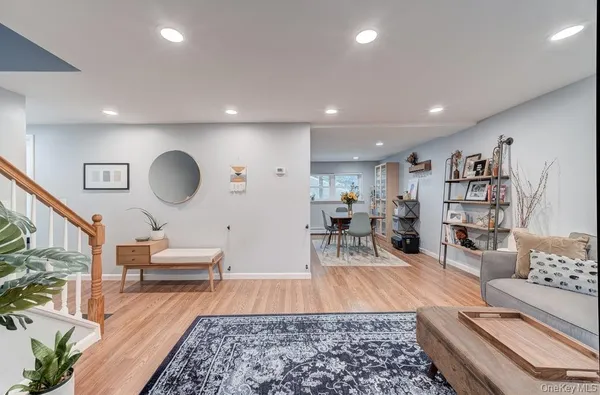 a living room with furniture and a rug
