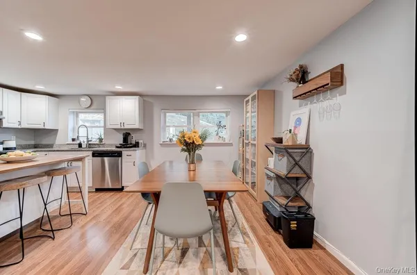 a view of kitchen with cabinets and wooden floor