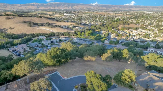 an aerial view of mountain with yard
