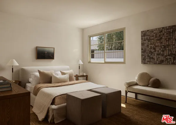 a living room with furniture a mirror and a shower