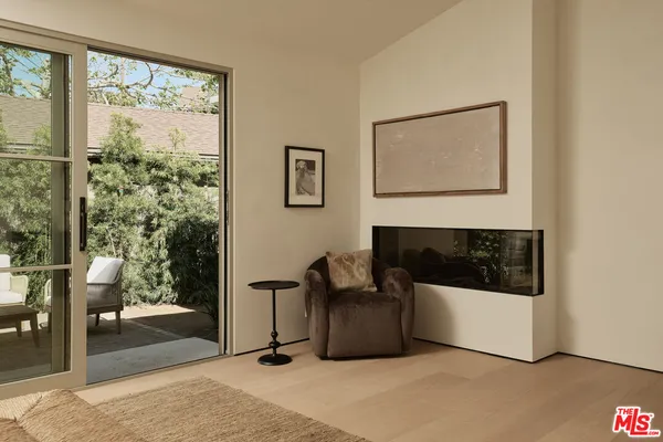 a spacious bathroom with a double vanity sink a bathtub and next to a window