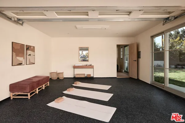 a front view of a house with outdoor seating