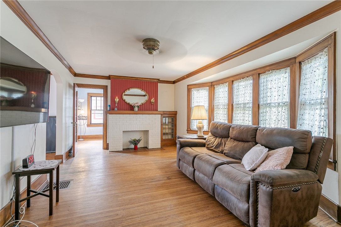 99 Wimbledon Road Irondequoit, NY 14617 - Photo 5 of 20 large living room, decorative fireplace, original