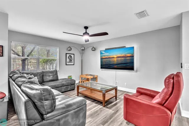 a kitchen with stainless steel appliances a refrigerator sink and microwave