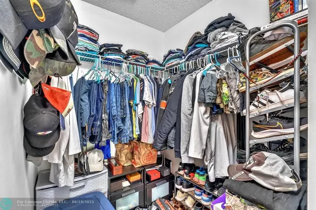 a bathroom with a sink vanity granite toilet and shower