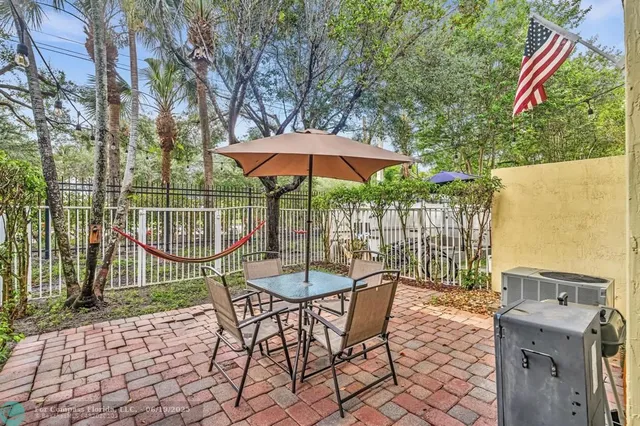 a view of a house with a backyard and a slide