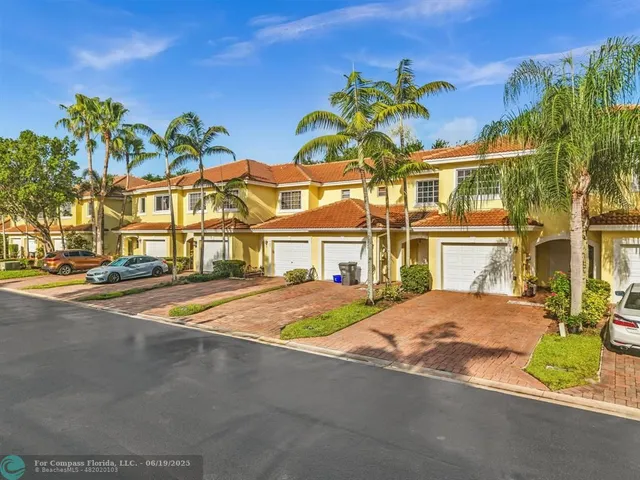 an aerial view of residential building and ocean