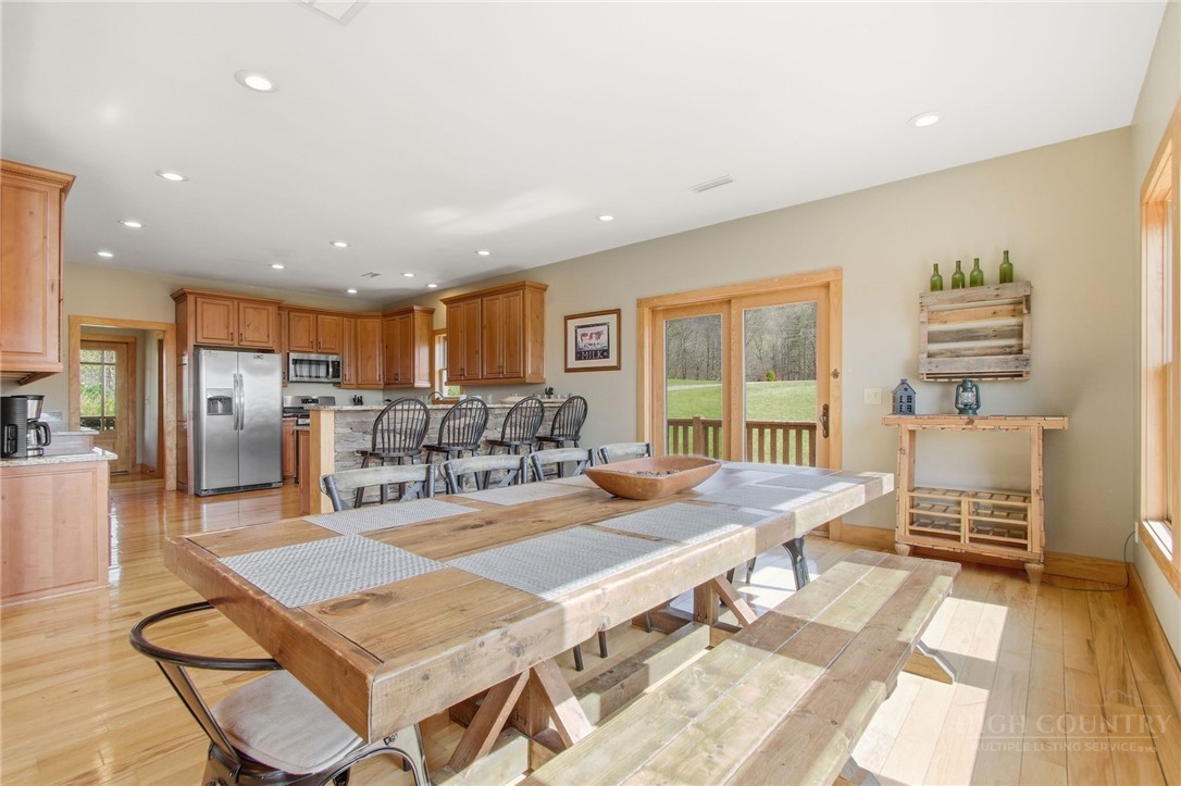 2081 Blackberry Road Boone, NC 28607 - Photo 23 of 45 a living room with furniture a rug and kitchen view