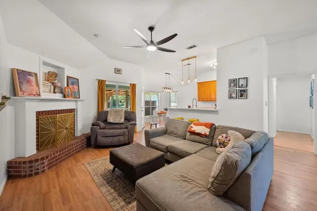 a living room with furniture and a fireplace