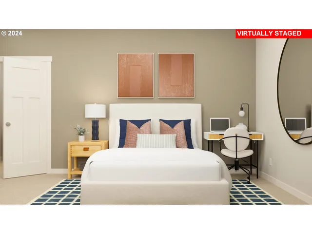 a bedroom with a bed a rug and a table