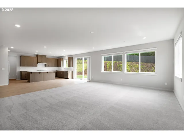 a view of a kitchen with a sink and a window