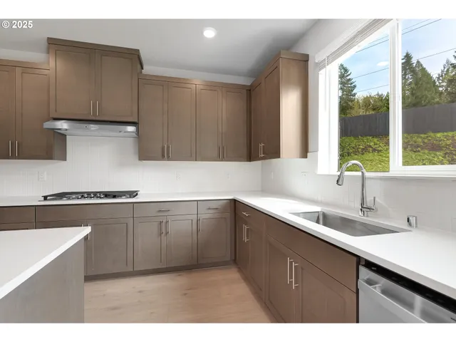 a kitchen with a sink and cabinets