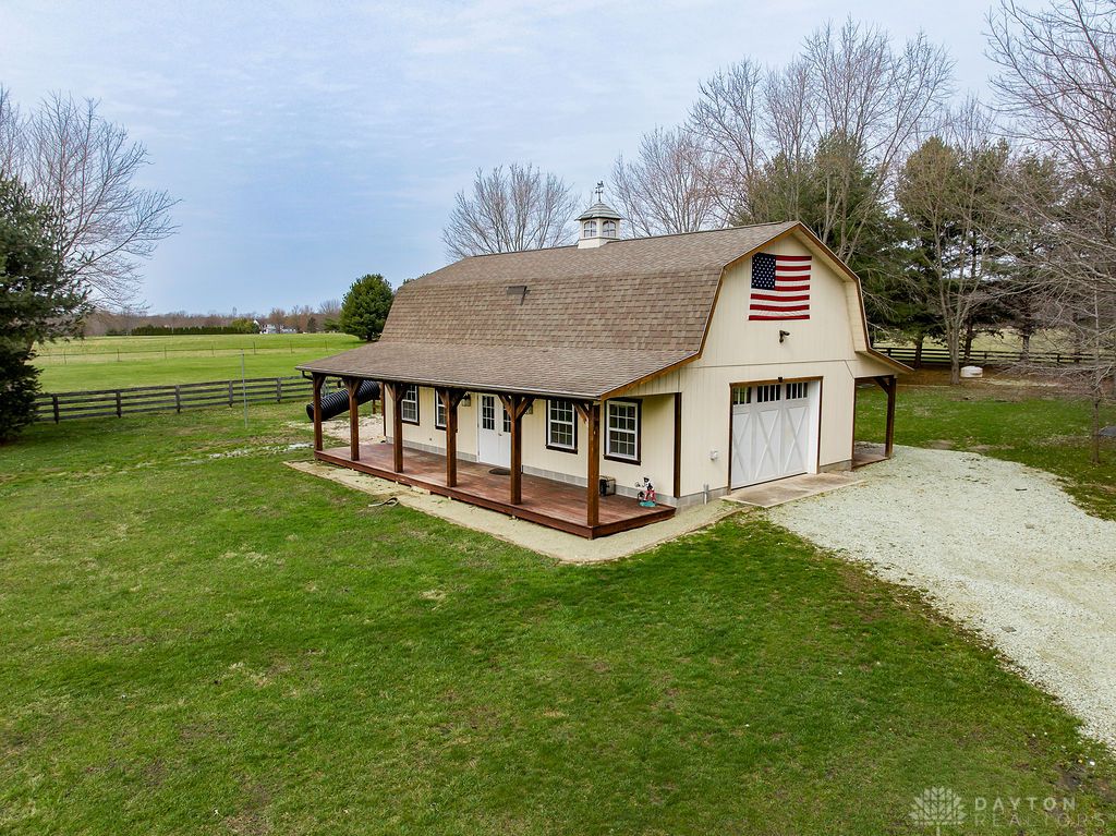 7400 Cook-Jones Road Waynesville, OH 45068 - Photo 12 of 72 This charming barn-style structure offers versatile space with a welcoming porch and expansive grounds.