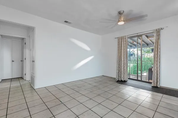 a view of an empty room and window