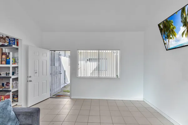 a view of an empty room with a window