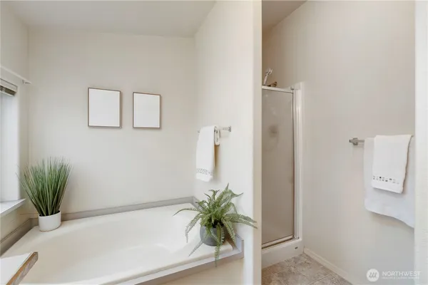 a white bath tub sitting in a bathroom