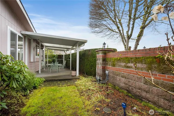 an aerial view of a house with outdoor space