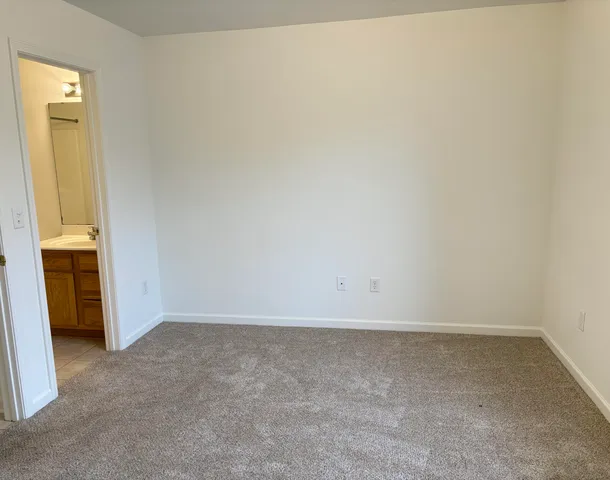 an empty room with a bathroom