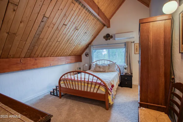 a bedroom with furniture and a window