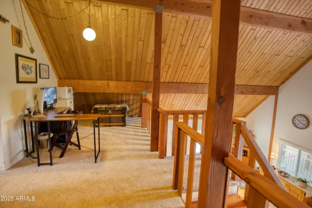 a bed sitting in a bedroom and a table