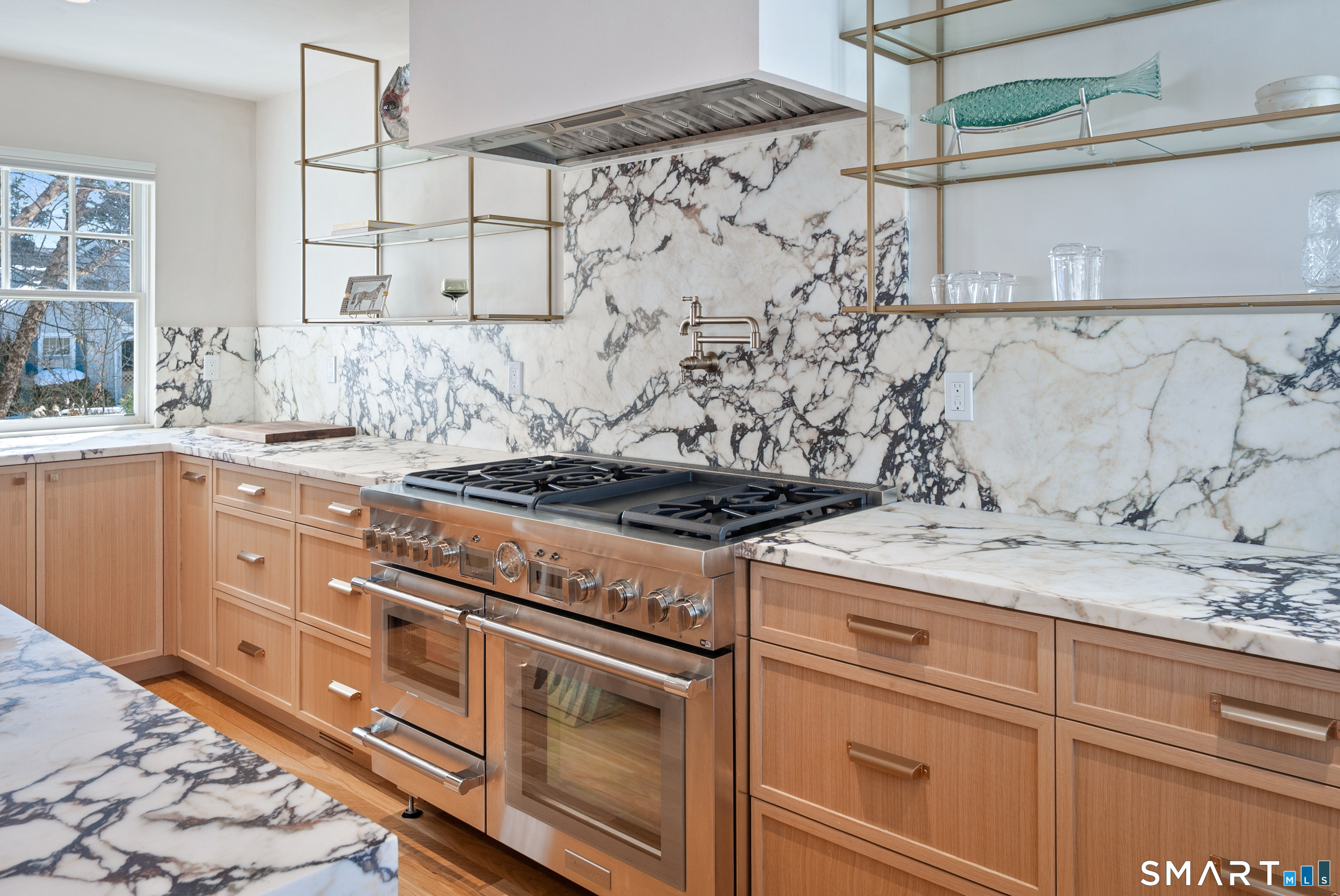 22 Craw Avenue Norwalk, CT 06853 - Photo 15 of 40 a kitchen with granite countertop a stove sink and cabinets