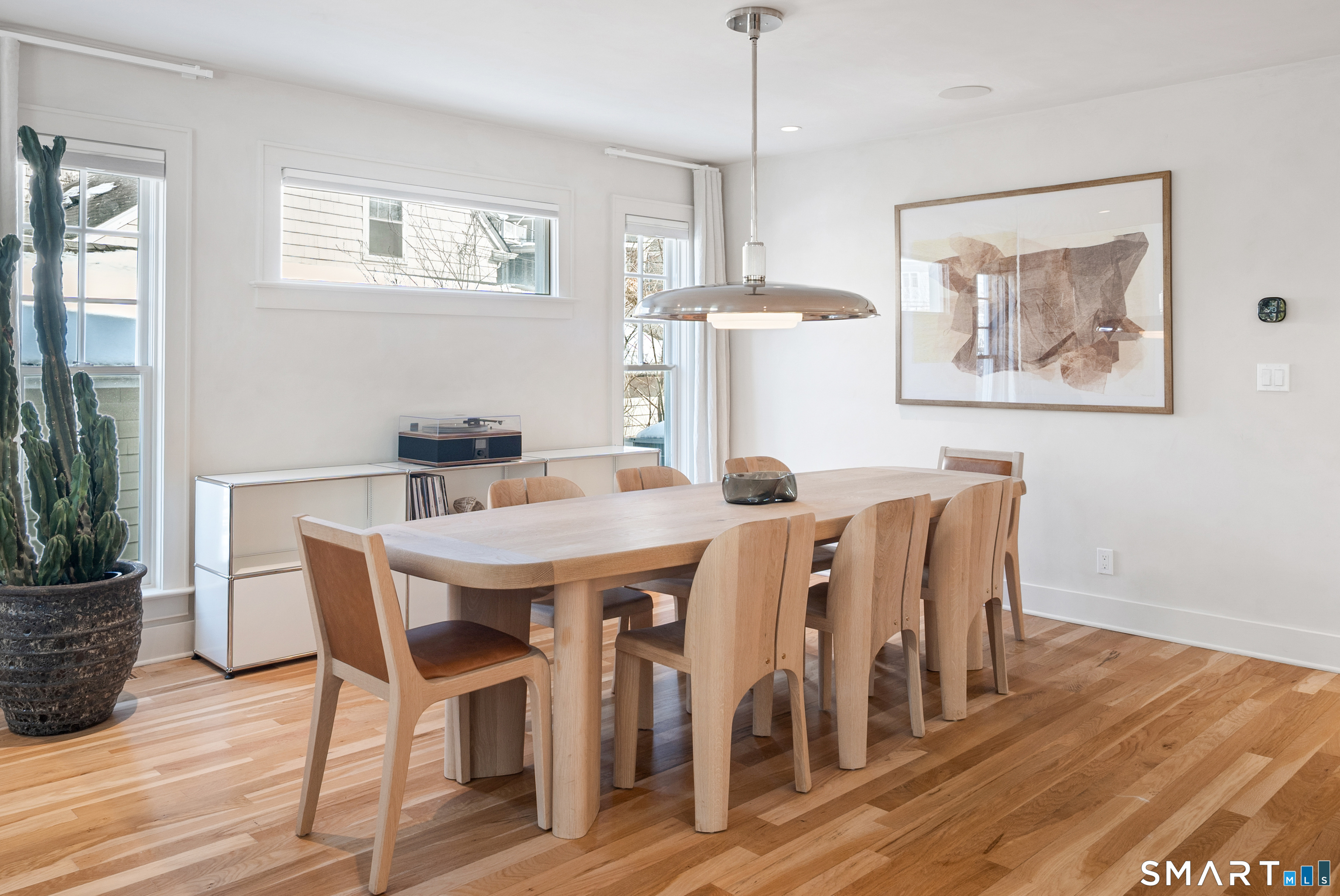 22 Craw Avenue Norwalk, CT 06853 - Photo 18 of 40 a view of a dining room with furniture wooden floor and a chandelier
