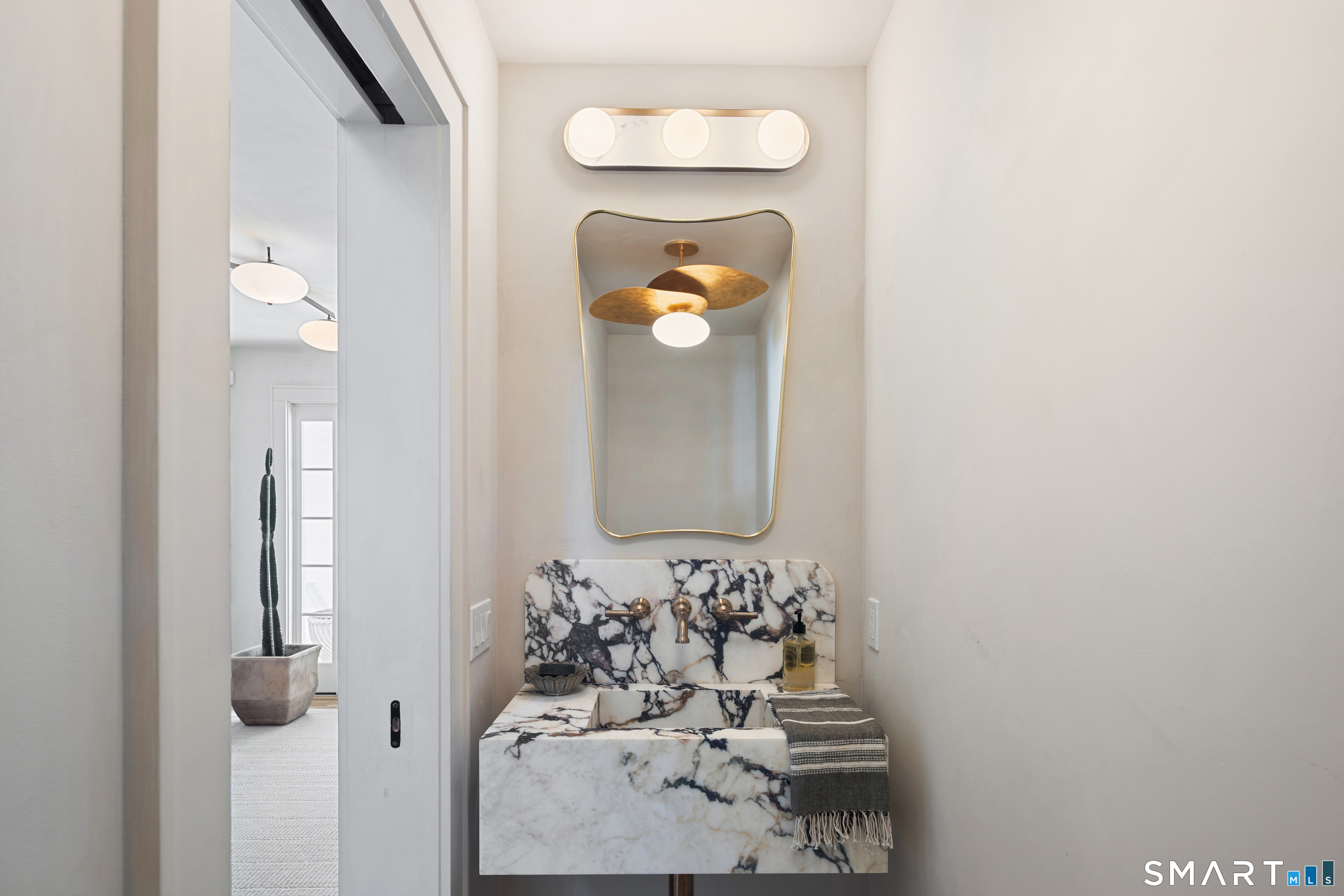 22 Craw Avenue Norwalk, CT 06853 - Photo 19 of 40 a bathroom with a sink and a mirror