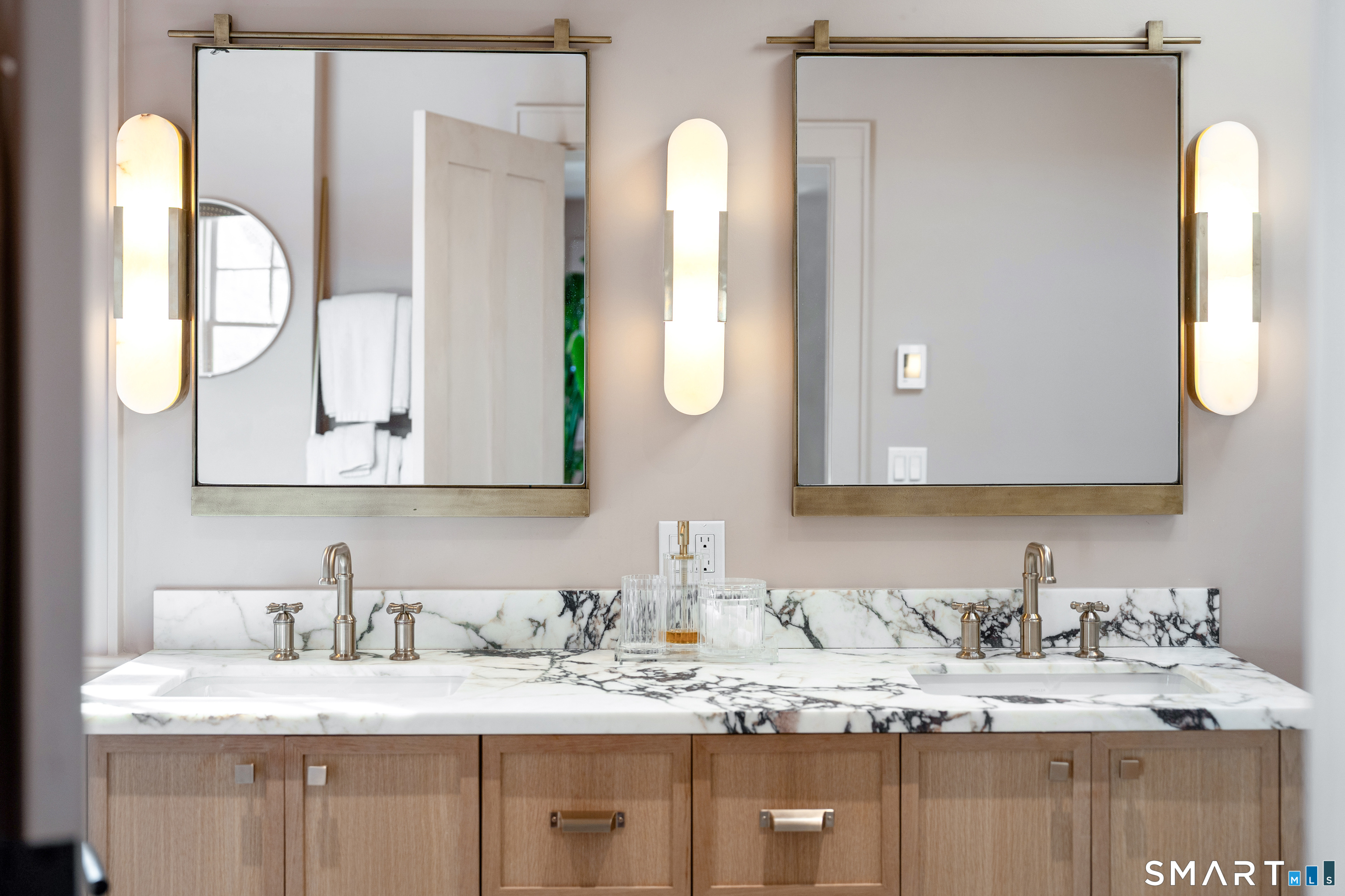 22 Craw Avenue Norwalk, CT 06853 - Photo 24 of 40 a bathroom with a granite countertop sink and a mirror