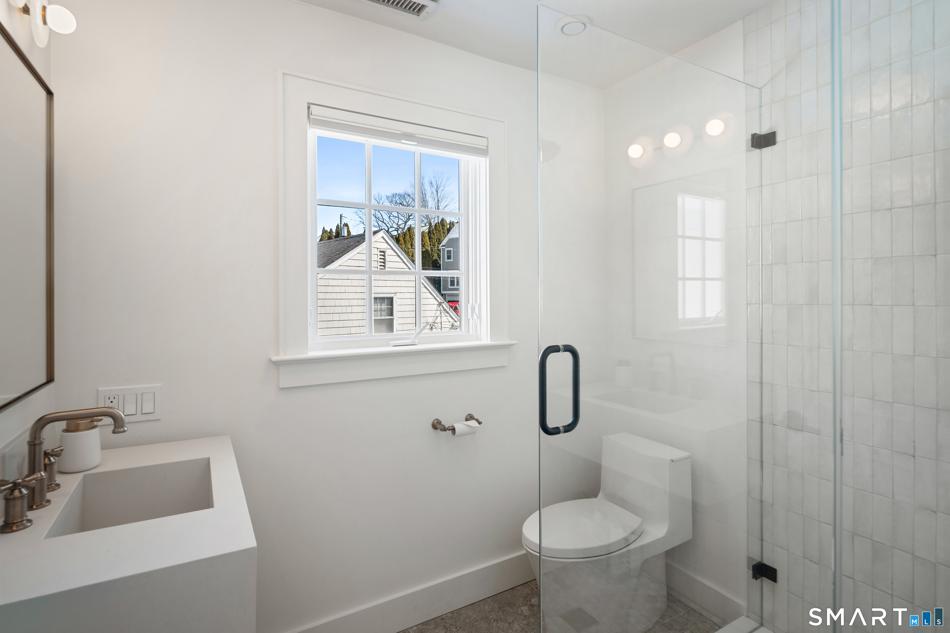 22 Craw Avenue Norwalk, CT 06853 - Photo 31 of 40 a bathroom with a toilet sink and shower